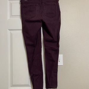 Wine colored mid-rise Rockstar denim
